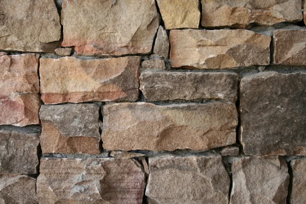 Цегла кам'яною стіною — стокове фото