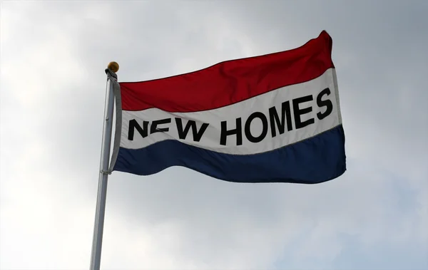 Nové domy vlajka — Stock fotografie