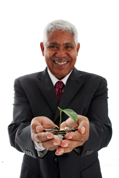 Άνθρωπος που κρατά το φυτό σε χρήματα — Φωτογραφία Αρχείου
