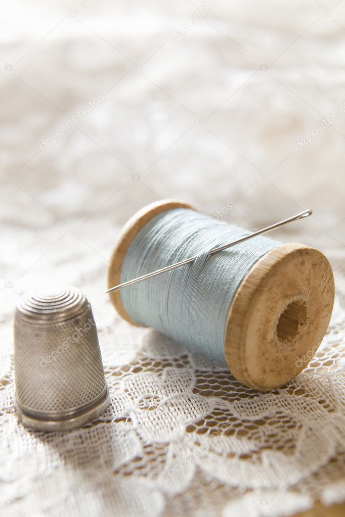 Vintage Cotton Reel With Needle And Silver Thimble On Lace