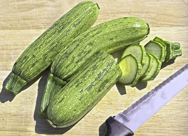 Zucchini on a wooden cutting board — Stock Photo, Image