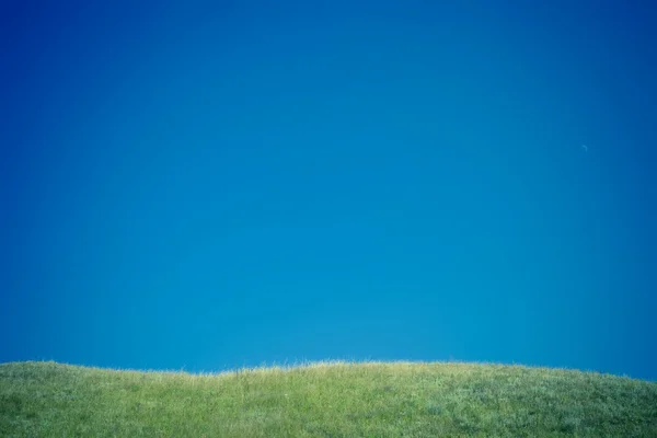 stock image Green hills and blue sky