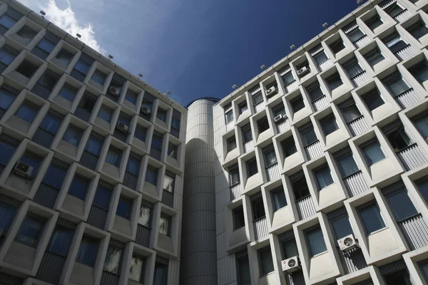 Stock image Facade of a grey building with the airconditioners