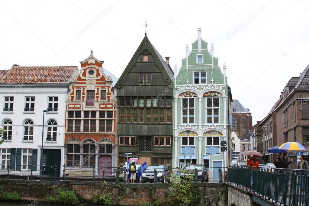 Three color houses on the river bank in Mechelen city