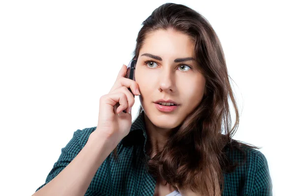 Дівчина розмовляє по телефону зі здивованим обличчям Ліцензійні Стокові Фото
