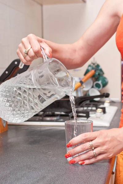 Hand pouring water — Stock Photo, Image