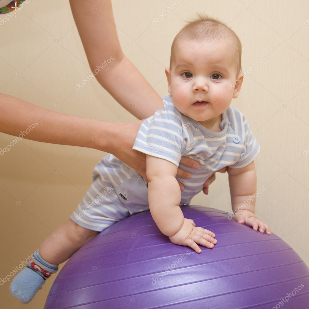 Baby playing ball — Stock Photo © Vitalinka #10056244