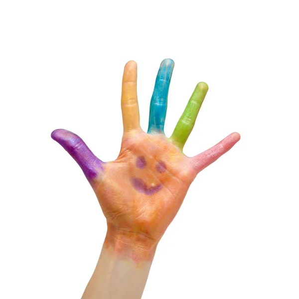 Цветная рука с раскрашенной улыбкой — стоковое фото