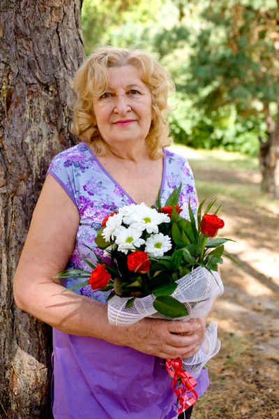 Elderly woman smiling — Stock Photo, Image