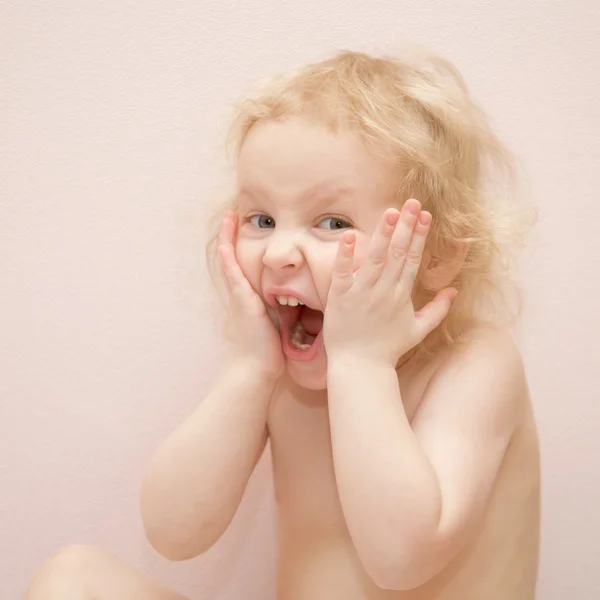 Baby girl with blue eyes surprised — Stock Photo, Image