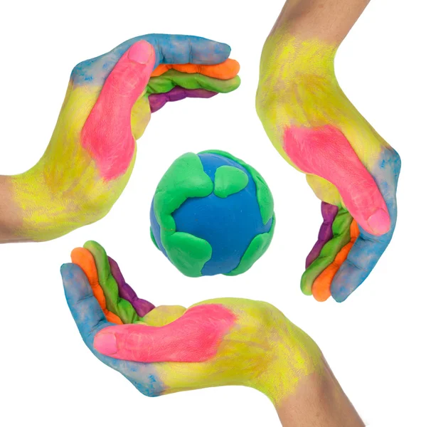 Colorful hands making a circle around earth globe — Stock Photo, Image