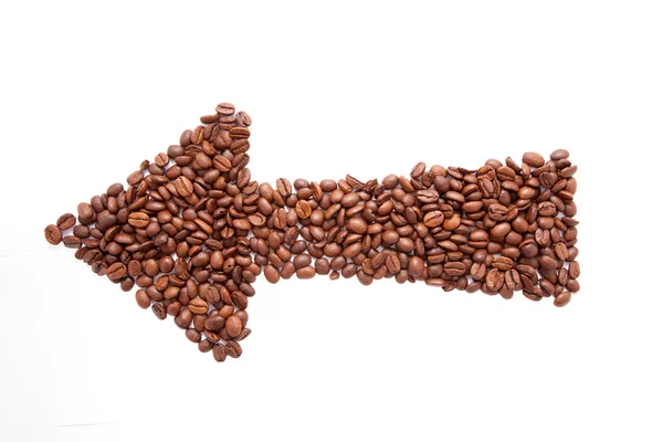 Arrow made of coffee beans — Stock Photo, Image