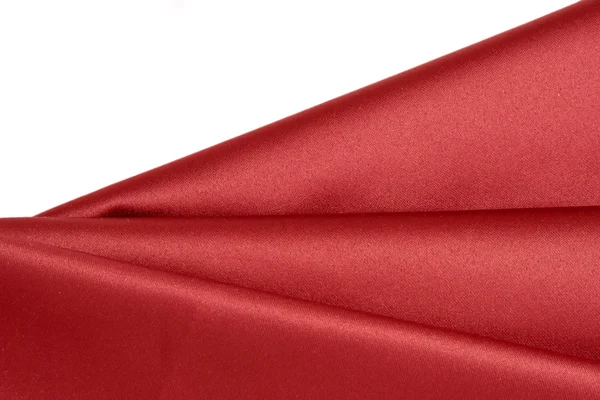 Pieghe di tessuto raso rosso liscio lucido . — Foto Stock