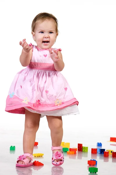 Mooie baby in roze jurk — Stockfoto