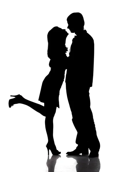 Silhouette of kissing happy couple — Stock Photo, Image