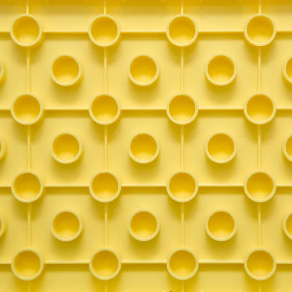 stock image Yellow plastic construction background