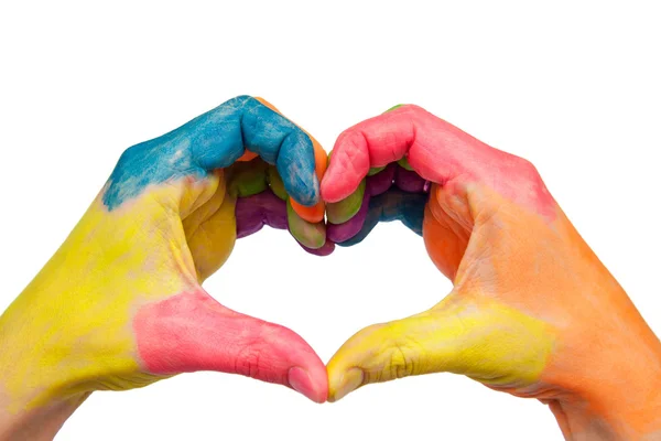Mãos coloridas mostrando uma forma de coração — Fotografia de Stock