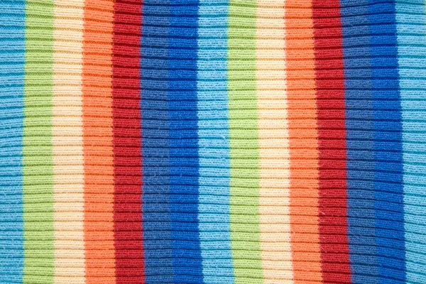 Tejer textura de lana de punto. Fondo multicolor de tela — Foto de Stock