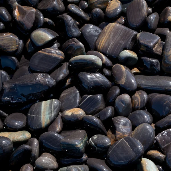 stock image Texture of polished rock on the beach