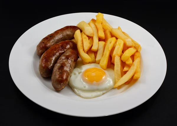 Close up of Sausage, egg and chips. — Stock Photo, Image