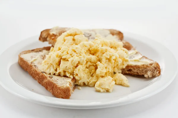 Scrambled eggs on toast — Stock Photo, Image