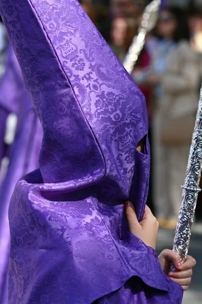 stock image Semana Santa, Nazarene with white purple robe in a procession