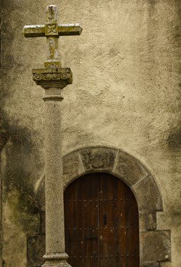 Cross and door