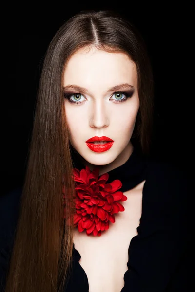 Girl and red flower — Stockfoto