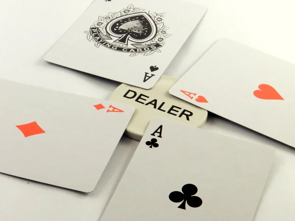 Stock image A poker hand of aces and the dealer