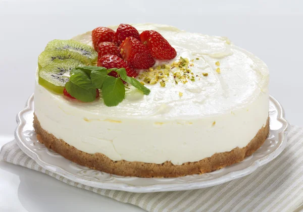 A fruit decorated cheese cake — Stock Photo, Image