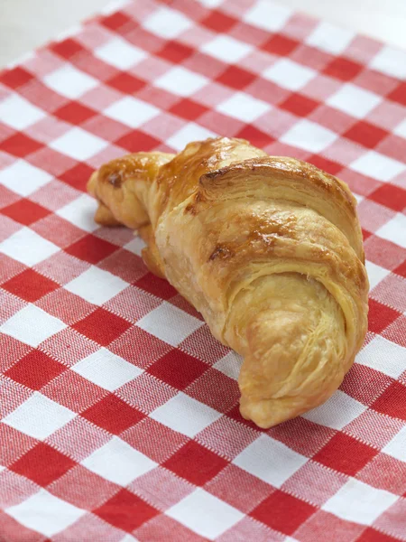 Croissant on a napkin — Stock Photo, Image