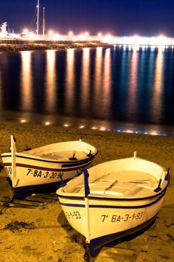 Harbour with boats and lights. clipart