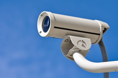 Security Camera against Blue Sky clipart