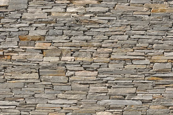 Grijze stenen baksteen muur achtergrond — Stockfoto