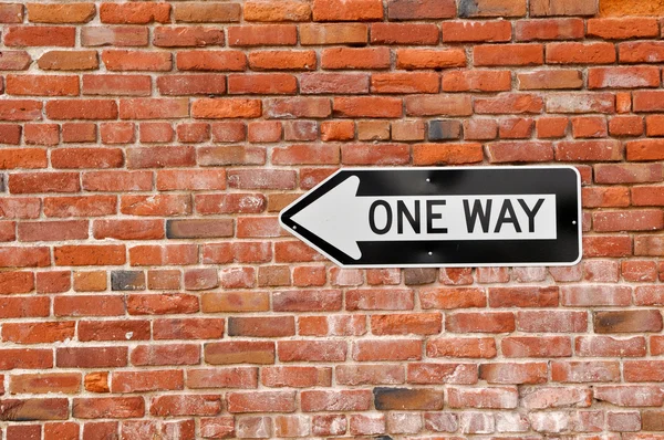 Brick Wall with One Way Sign — Stock Photo, Image