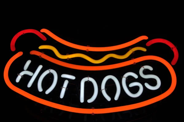 Hot Dogs néon rouge, jaune et blanc signe — Photo