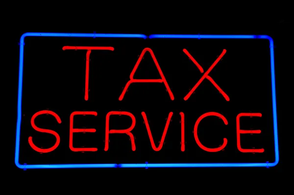 Czerwony neon usługi podatkowe — Zdjęcie stockowe