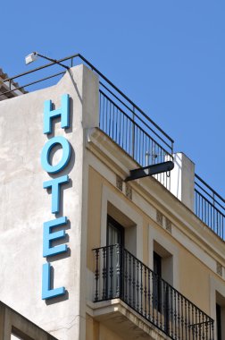 Hotel Sign on Old Building clipart
