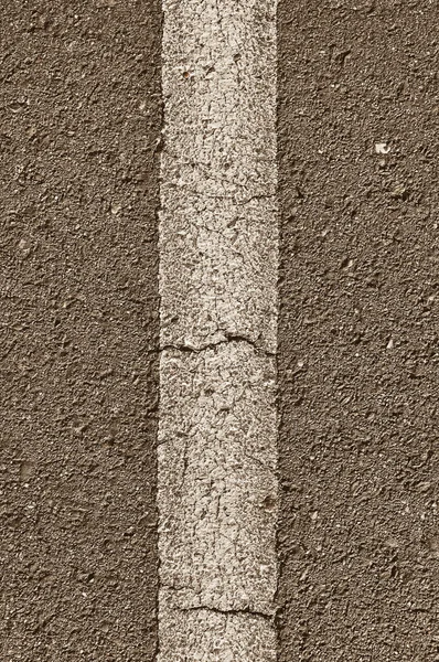 Asfalto com linha branca vertical — Fotografia de Stock