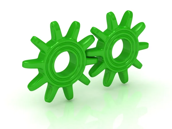 Два зелёных шестерёнка — стоковое фото