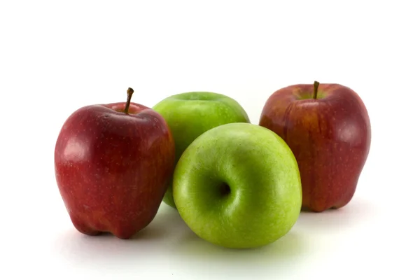 Green apples betwin red — Stock Photo, Image