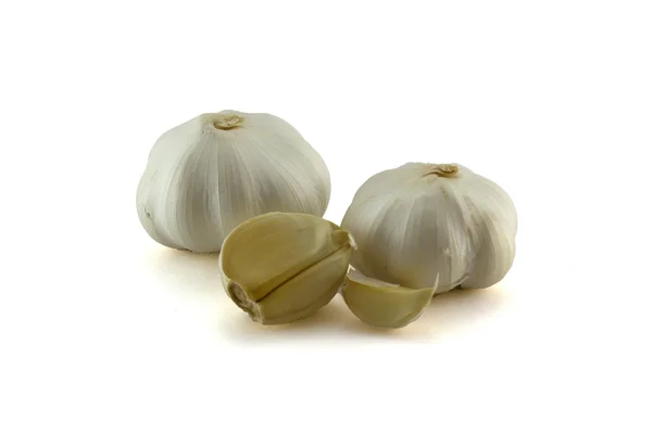 Garlic heads with clows — Stock Photo, Image
