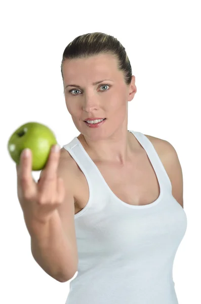 Portrét veselá mladá dáma jíst jablko izolované nad wh — Stock fotografie