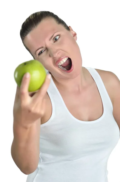Портрет веселой юной леди, поедающей яблоко, изолированное над которым — стоковое фото