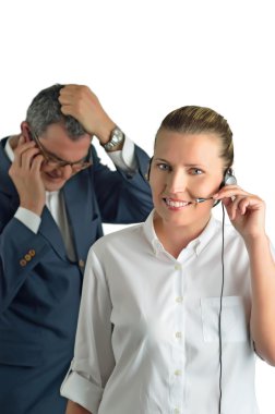 Beautiful business woman with headset and talking to a businessm clipart