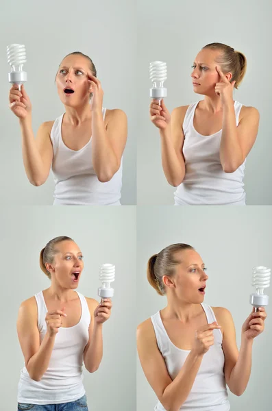 電球を保持するいるとアイデアを持つ美しい若い女性 — ストック写真