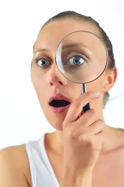 Healthy blondy happy woman looking with a magnifying glass — Stock Photo, Image