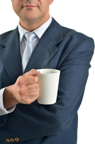 Empresario sosteniendo una taza de té aislado en blanco — Foto de Stock