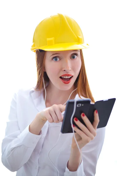 Young beautiful female with yellow helmet using a cellphone — Stock Photo, Image