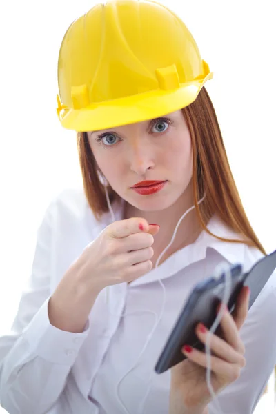 Young beautiful female with yellow helmet using a cellphone — Stock Photo, Image